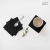 Černé látkové podtácky Linen Tales – sada 4 kusů