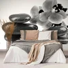 Černobílé kameny s orchidejí – elegantní fototapeta