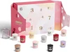 Dárkový set Yankee Candle: 12 votivních svíček a elegantní svícínek
