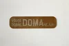 Dřevěná dekorace na zeď Doma nejlíp Ořech 25x6 cm